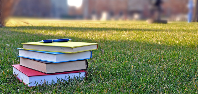 college books on lawn feat