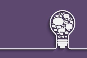 speech bubbles inside of an idea lightbulb