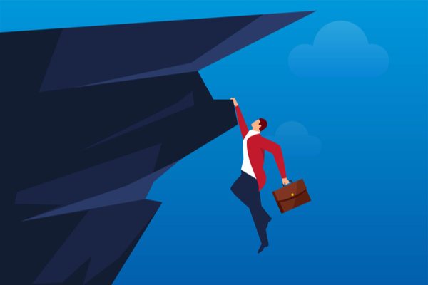 Professor hanging on a cliff.